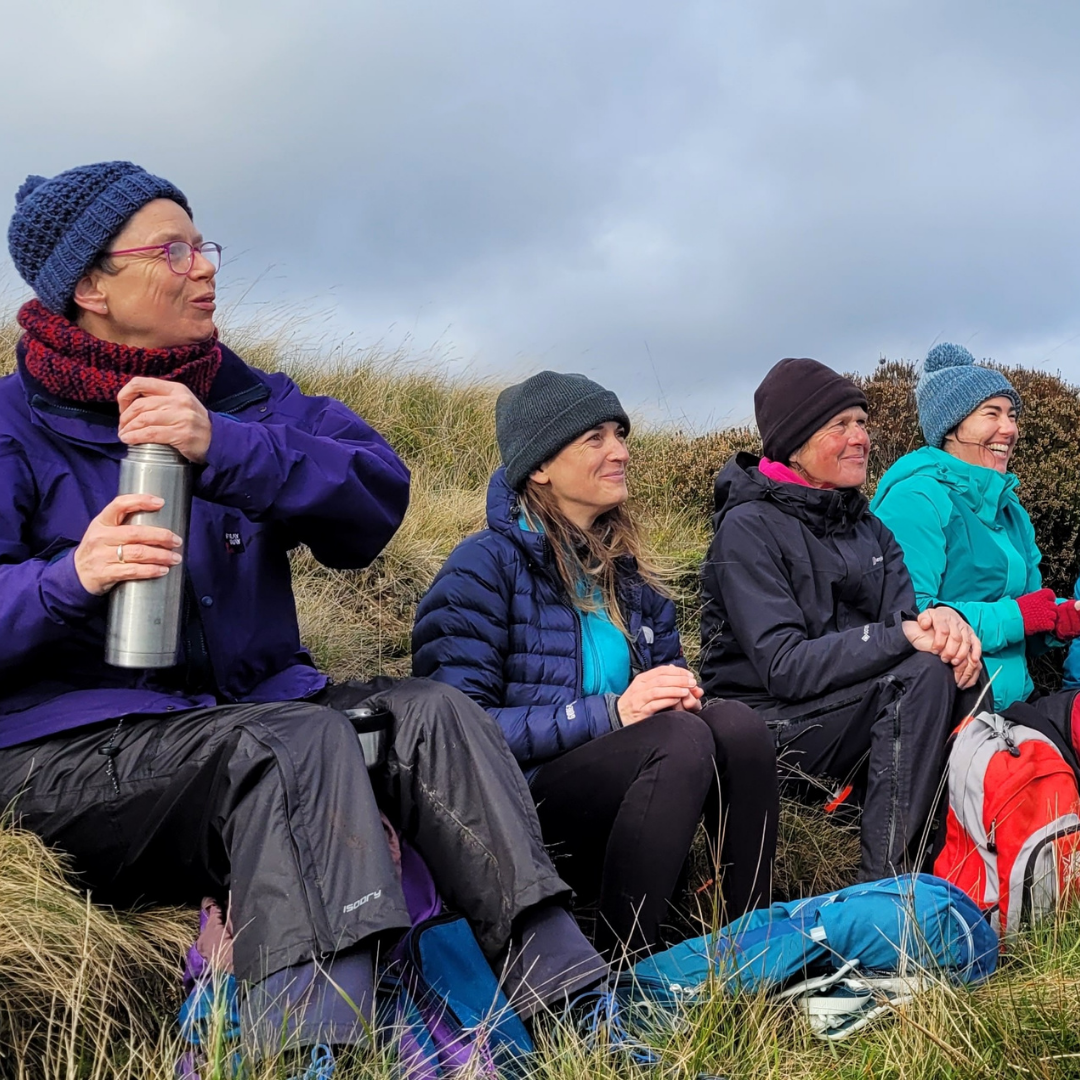 Group of people taking a break during a Mind Over Mountains hike
