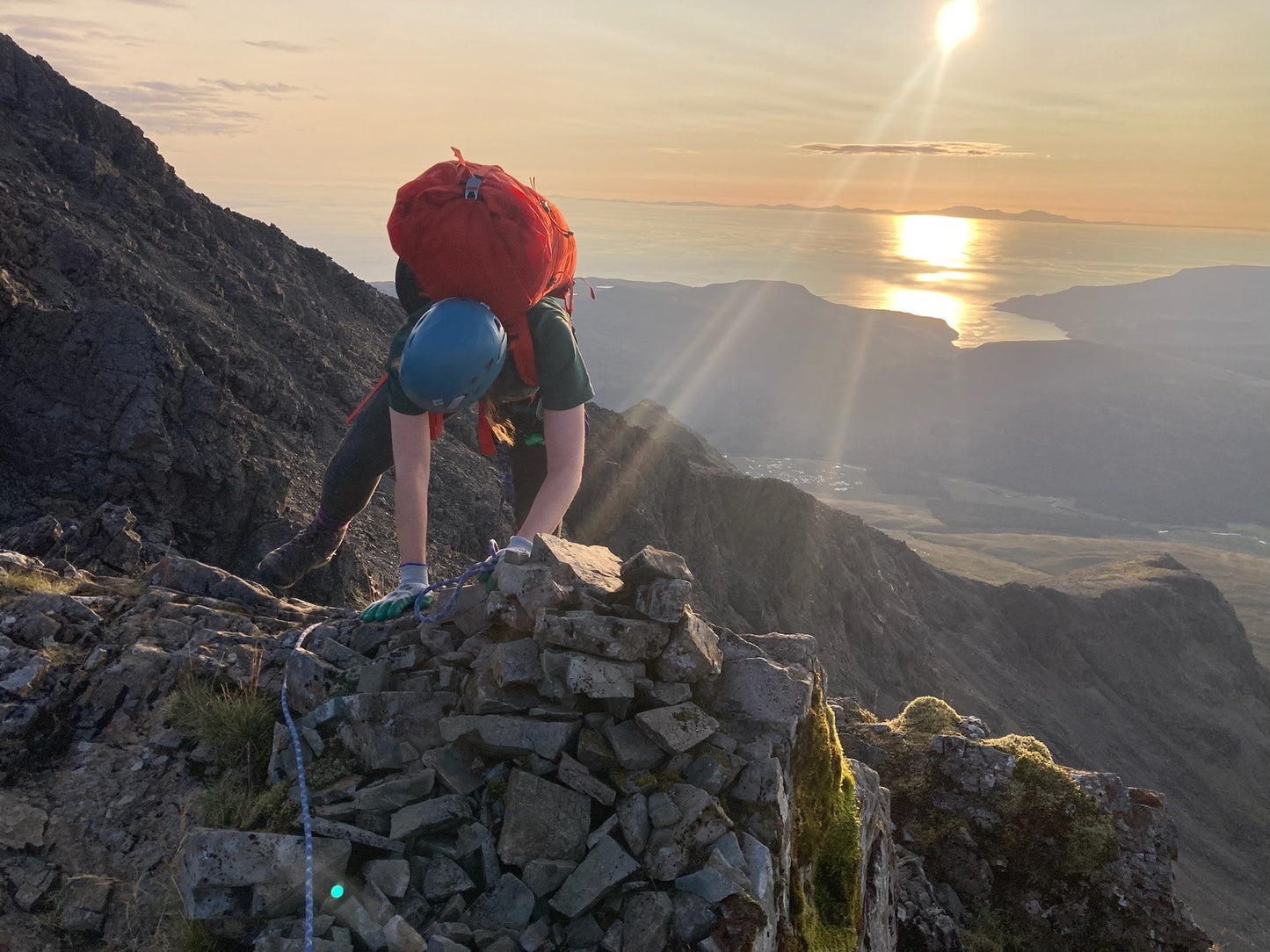 Woman with rucksack climbing