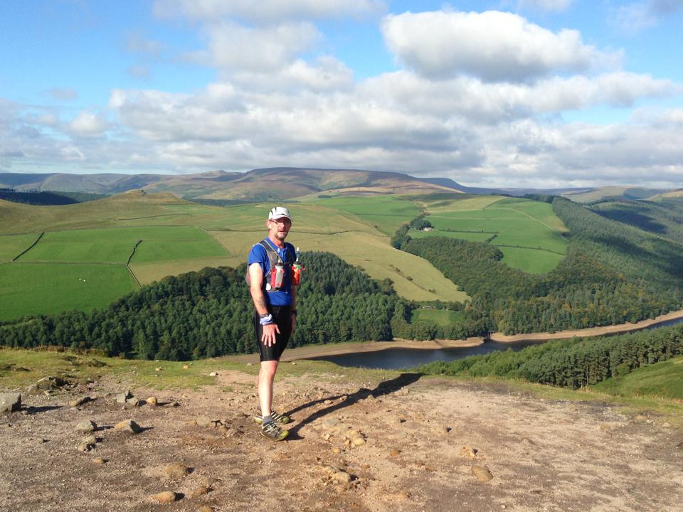 Image of man walking in hills during mental health walk