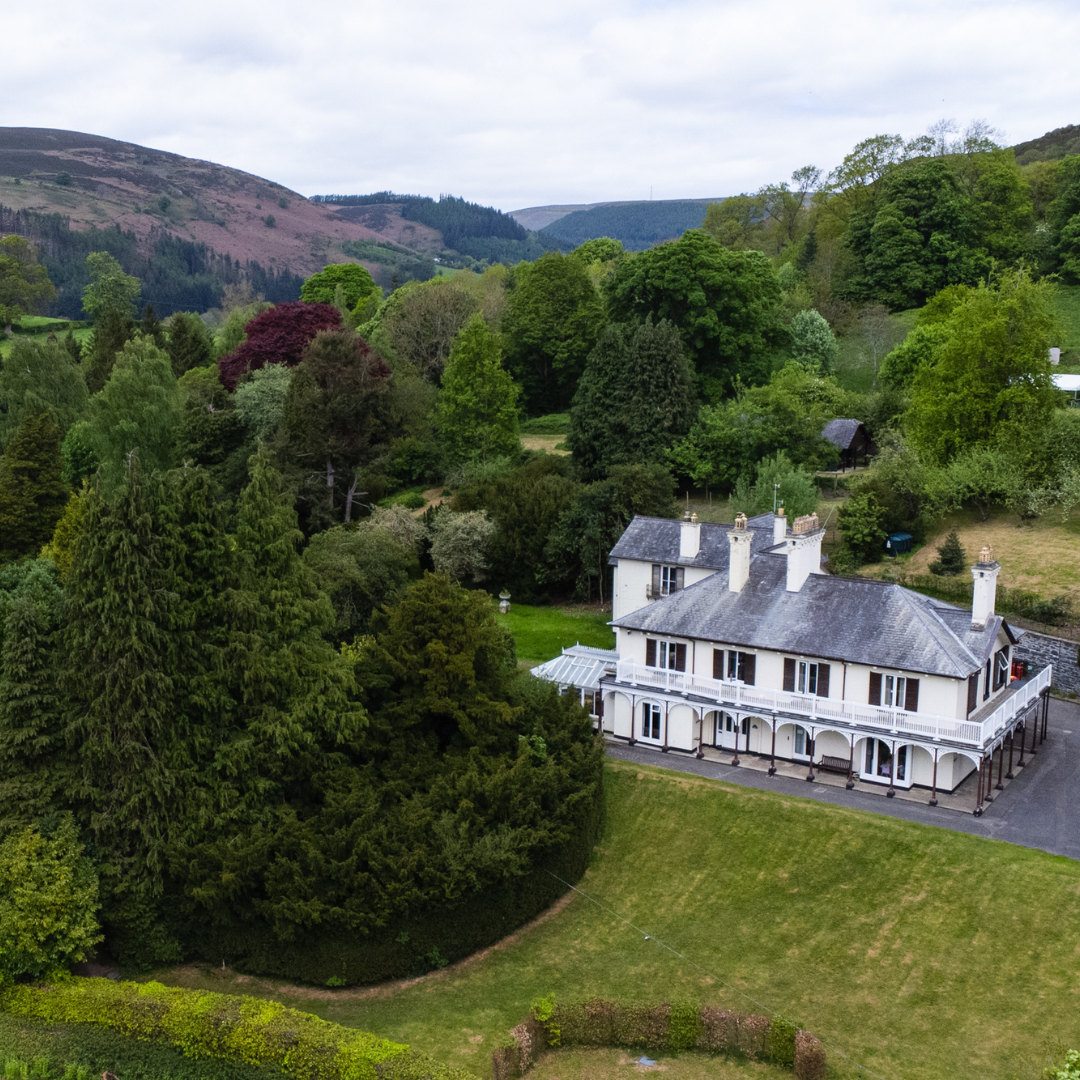 Bryntysilio Hall North Wales nestled amongst trees and hills
