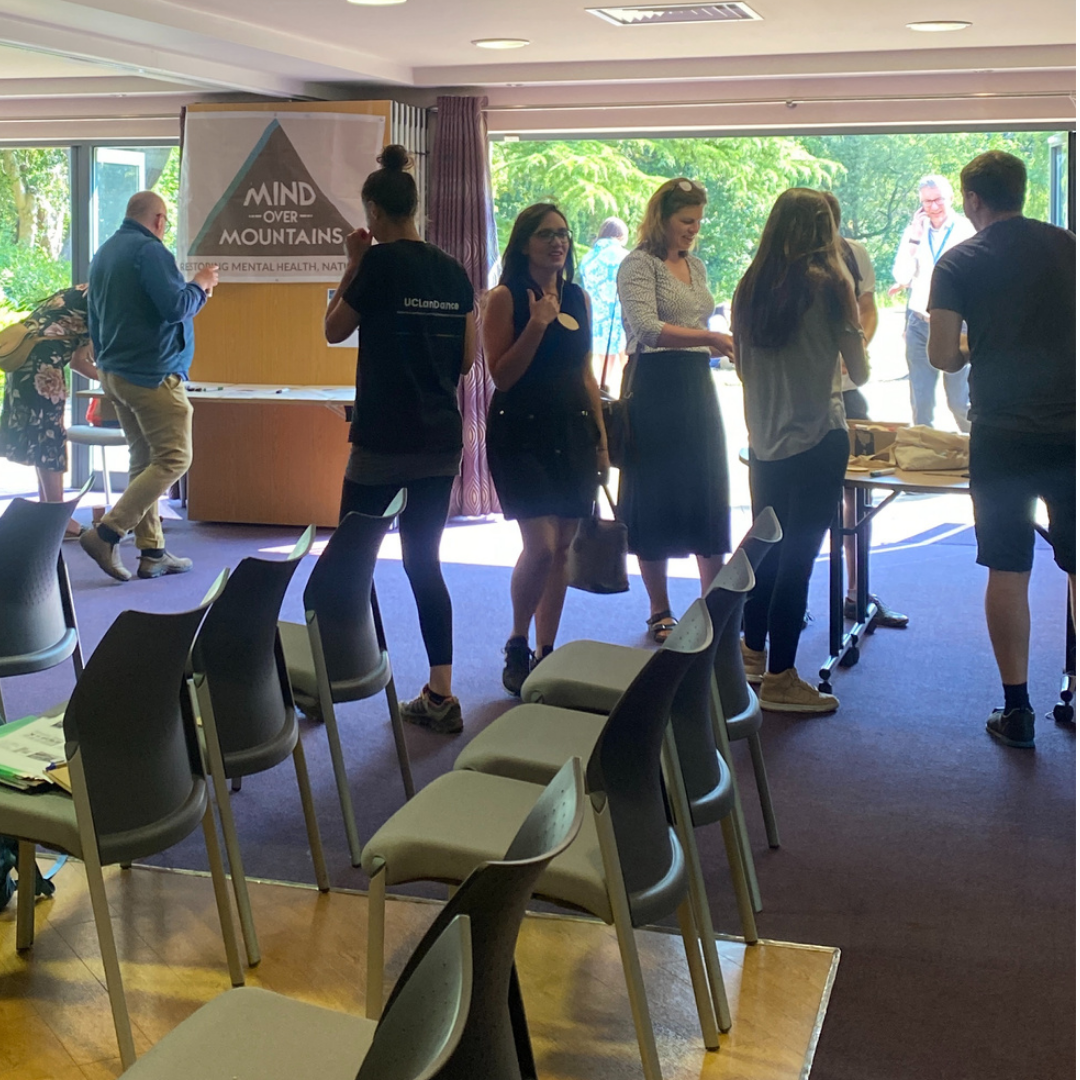 group of people and chairs in conference venue for NatureMind nature therapy summit