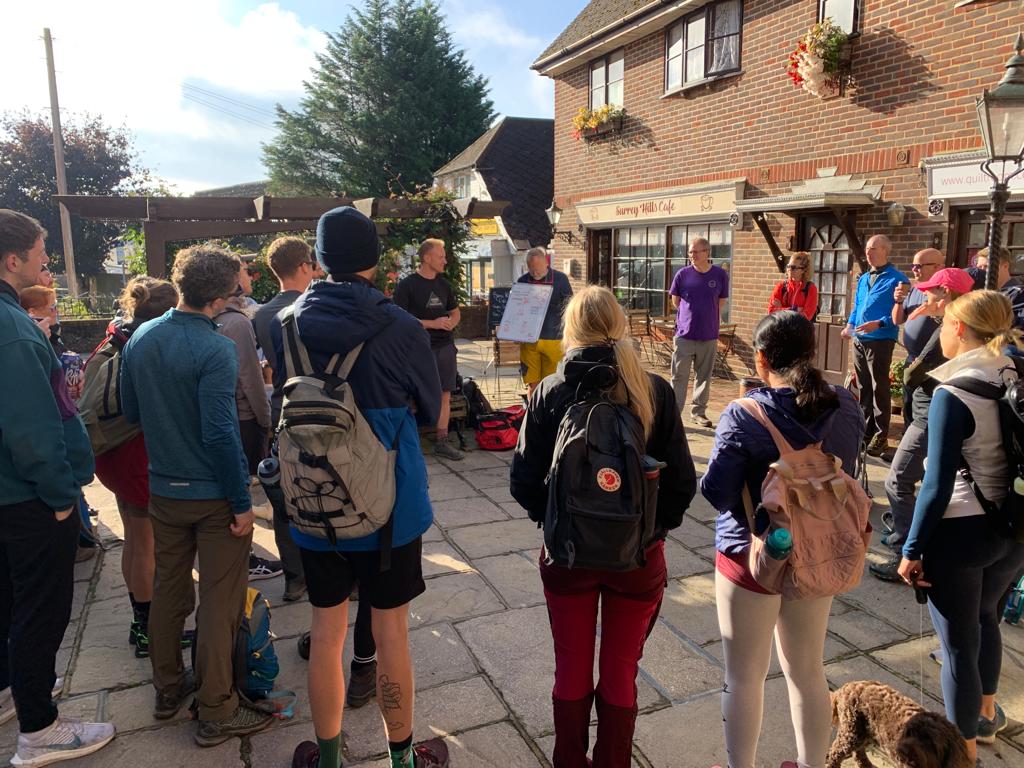 team being coached outdoors by Mind Over Mountains wellbeing coach