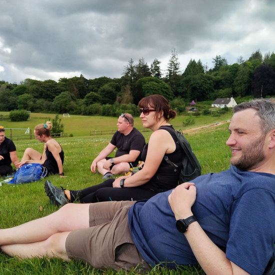 a rest during a hike - group of hikers on Dartmoor with Mind Over Mountains