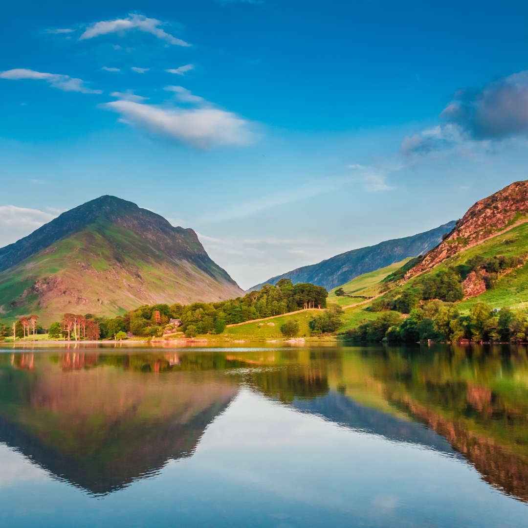 Mountain landscape with a lake reflecting the greenery