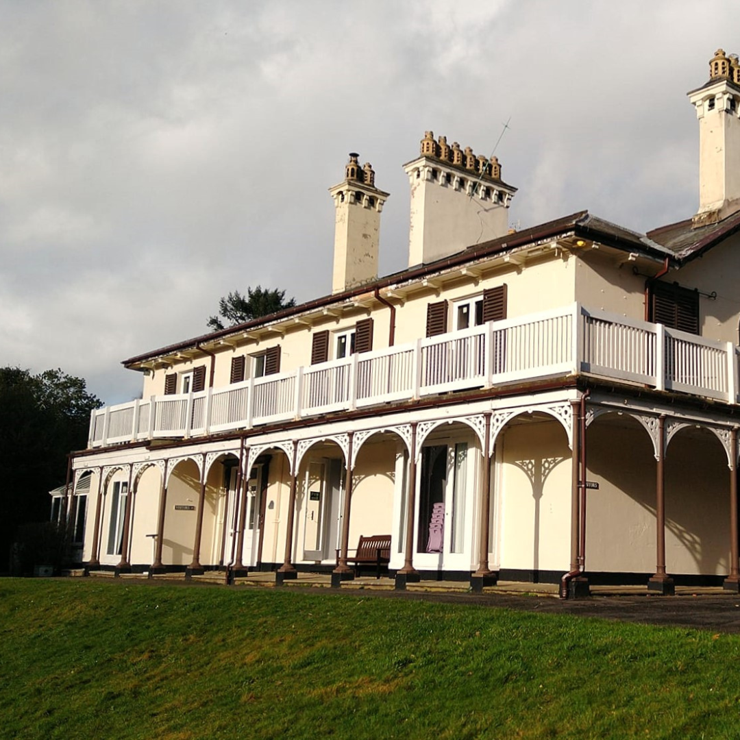Bryntysilio Hall north wales - victorian villa white building on grassy bank