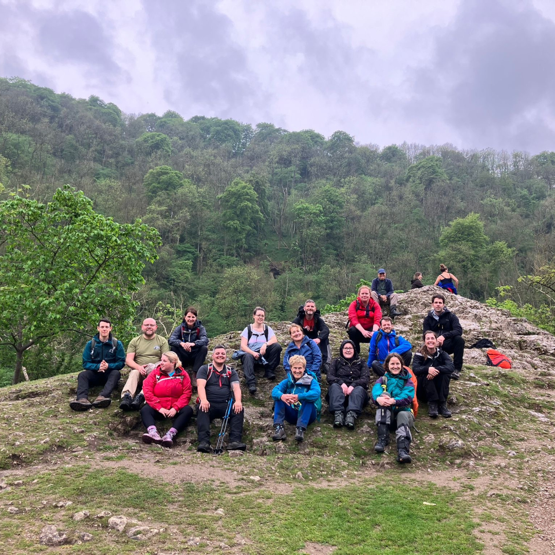 Hikers smiling on mountain side