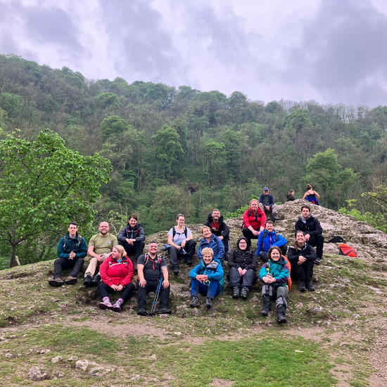 Hikers smiling on mountain side