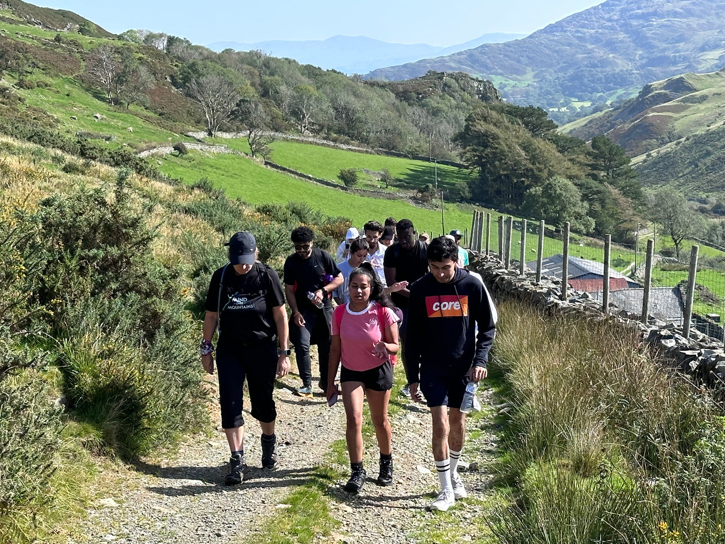 group walking with Mind Over Mountains charity in hills of Wales