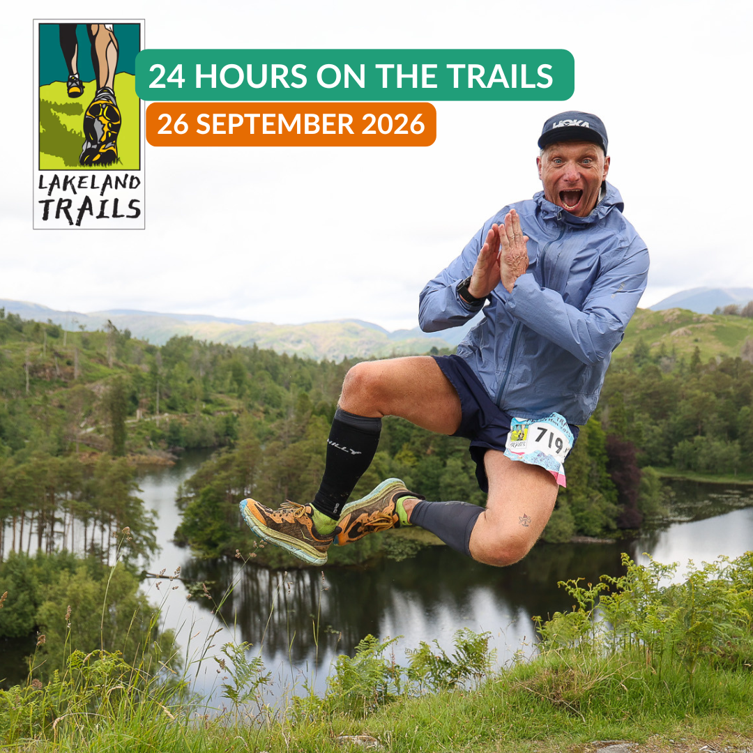 Man jumping in the air with a scenic background and 24 Hours on the Trails with Lakeland Trails event details overlayed