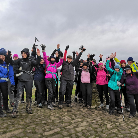 hiking group having fun - arms in the air