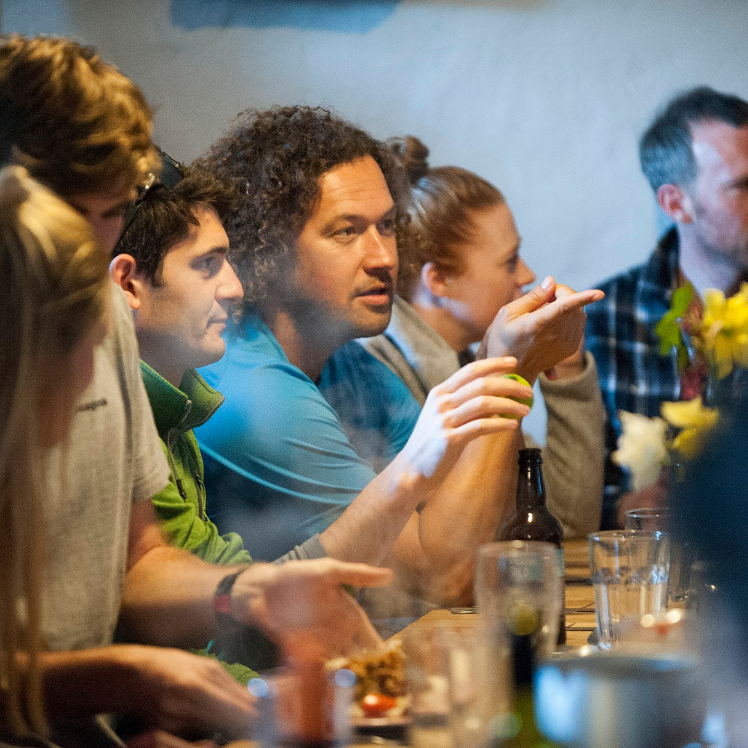 group of people sharing meal at table 