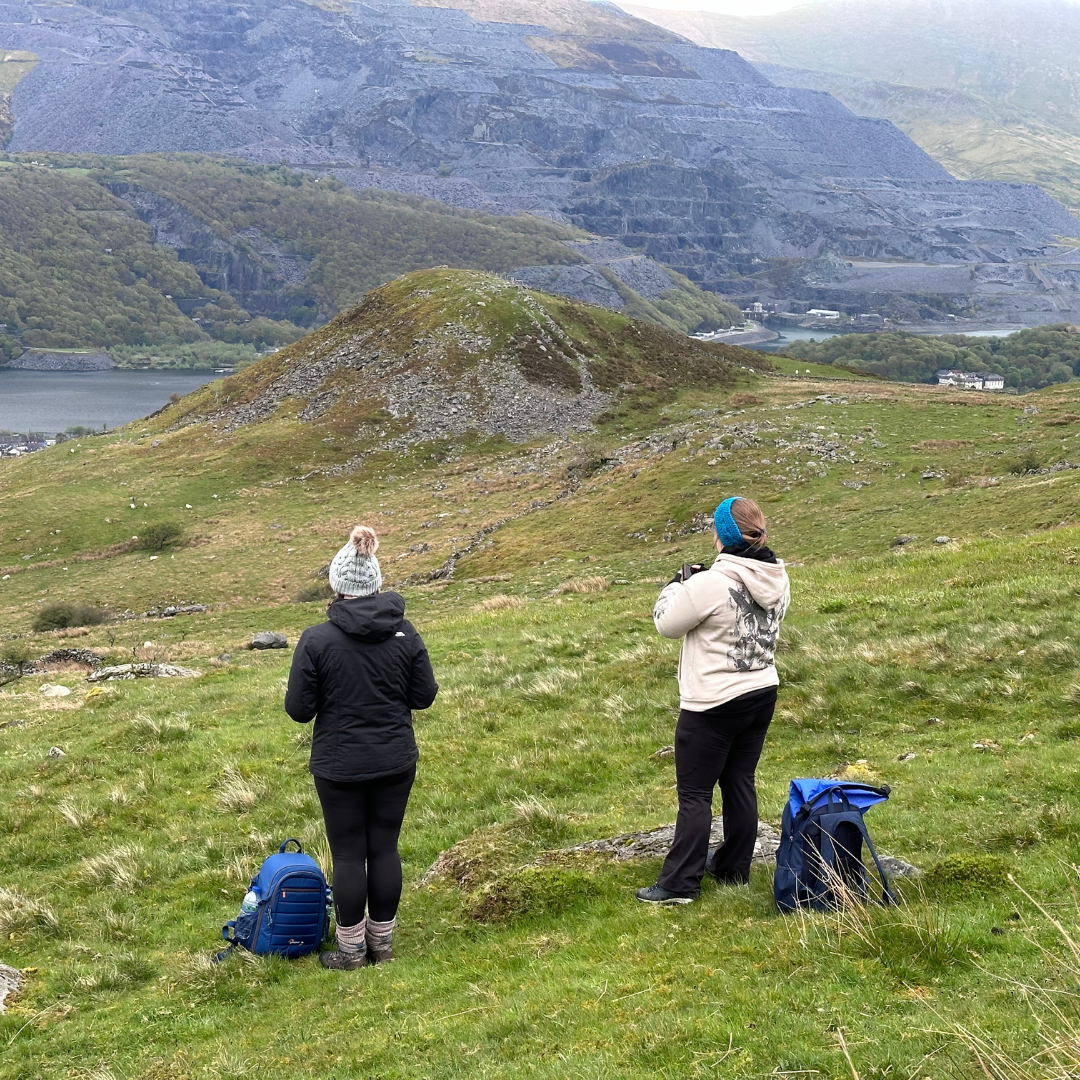 2 hikers look at view Wales