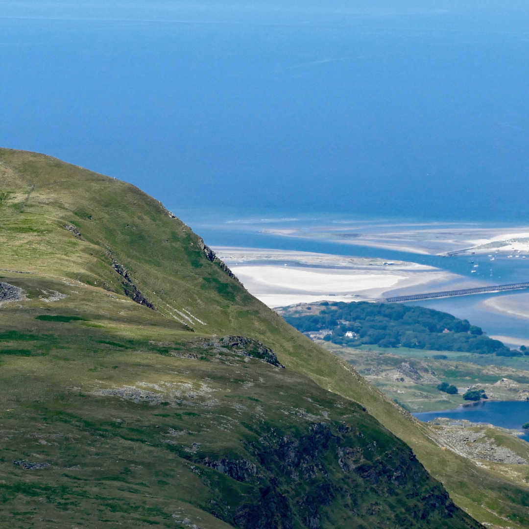 coastal view from Welsh mountains on Mind Over Mountains wellbeing retreat