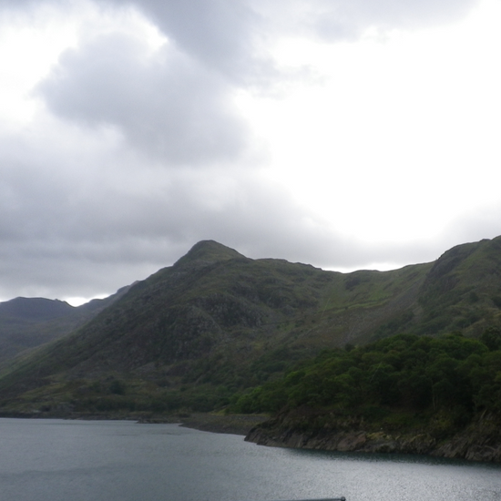 welsh mountains and lake with cloudy sky